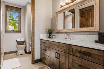 The second primary includes a luxurious ensuite with walk-in shower