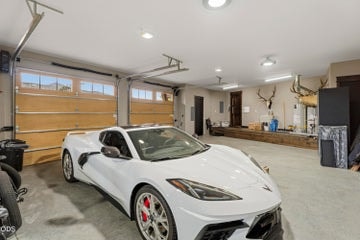3-car garage offers space for vehicles, hobbies, and more