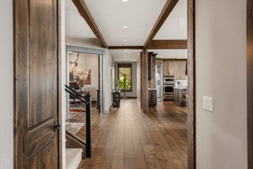 View of foyer, office, great room, staircase, and hallways