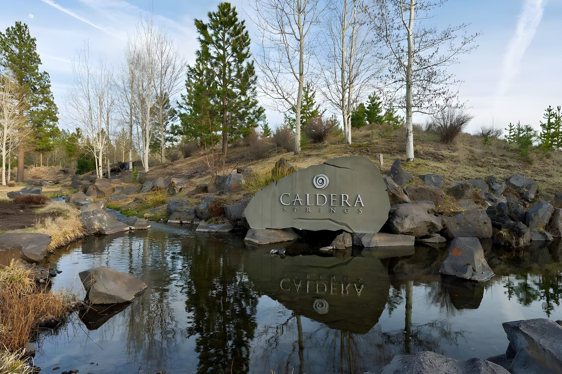 The engraved Caldera boulder and pond at Caldera Springs, Sunriver, Oregon