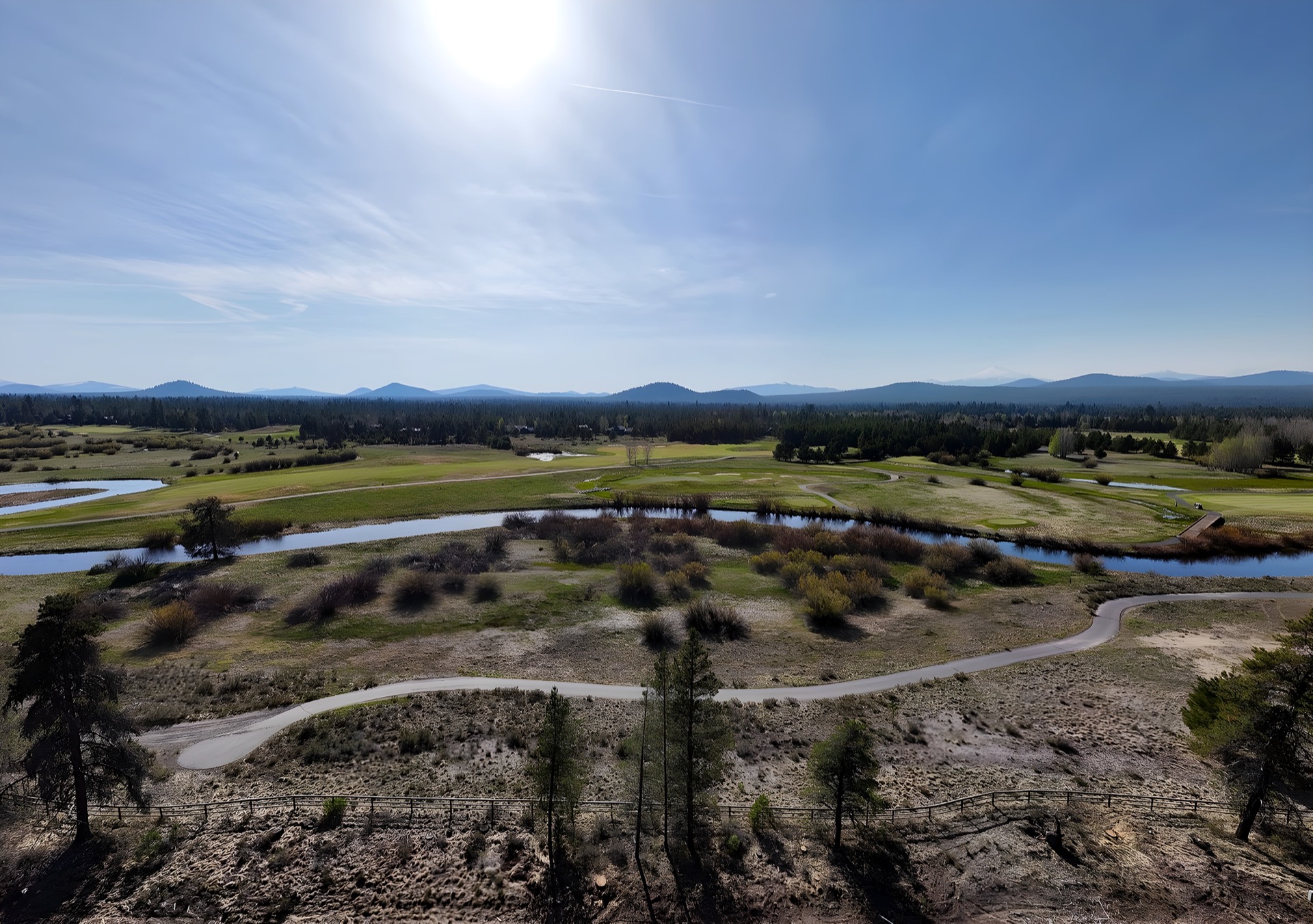 Crosswater Club fairway with wetlands and Cascade backdrop